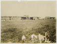Photograph: [Planes in Front of Hangar]
