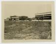 Photograph: [Four Airplanes in Front of Hangar]