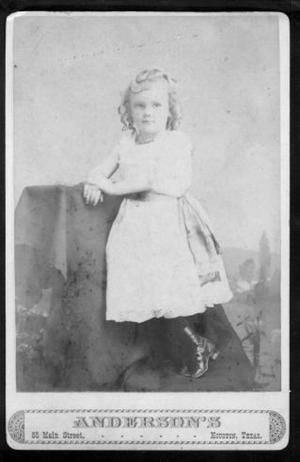 Primary view of object titled '[A little girl wearing a light colored dress.]'.
