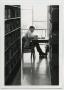Primary view of [Photograph of Student Studying at the Library]