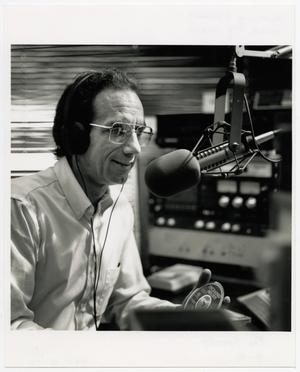 Primary view of object titled '[Photograph of Joe Specht at a Microphone]'.