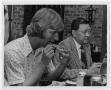 Primary view of [Photograph of Dr. Thomas Kim Eating with Students]