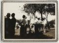 Thumbnail image of item number 1 in: '[Crowd of people standing under trees]'.