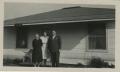 Photograph: [Photograph of Churchgoers in Front of House]