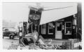 Photograph: [Train Wreck at Gas Station]