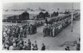 Photograph: [Funeral Procession in the Middle of P. O. W. Camp]