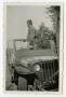 Primary view of [Photograph of a Soldier in a Jeep]