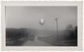Photograph: [Photograph of Barrage Balloon and Army Vehicles]