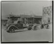 Photograph: [Truck Parked by Auto Parts Shops]