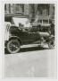 Photograph: [Two Firefighters in a Car]