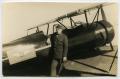 Photograph: [Photograph of Soldier and Biplane]