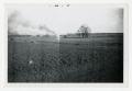 Photograph: [Photograph of Field with Smoke in the Distance]