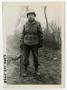 Photograph: [Man Standing in Muddy Road]