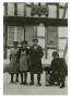 Photograph: [Photograph of Soldier and Family at Bakery]