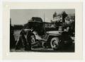 Photograph: [Photograph of Soldiers Working on Jeep]
