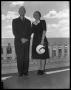 Photograph: [Man and Woman Standing on Balcony]