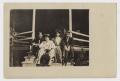 Primary view of [Four Men and Women Sitting on the Front Steps of a Building]