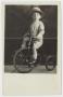 Postcard: [Walter M. Woodward on a Tricycle]