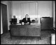 Photograph: [Portrait of man seated at desk at Covert Automobile Co.]