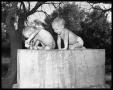 Photograph: Two Small Boys on a Water Fountain
