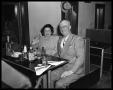 Photograph: [Couple Seated in Restaurant Booth]