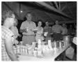 Photograph: [Lyndon and Lady Bird Johnson Standing in an Outdoor Food Line]
