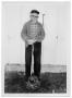 Photograph: [Otto Lindig Standing over a Ball and Chain]