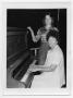 Photograph: [Woman Playing a Piano]