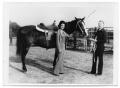 Photograph: [Man and Woman with a Horse]
