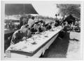Photograph: [People Seated at a Picnic Table]