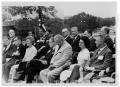 Photograph: [Lyndon Johnson Sitting with Rows of People]