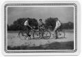 Photograph: [Three Students on Bikes]