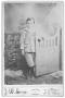 Primary view of [Portrait of John Conrad Leaning on a Gate]