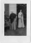Photograph: [Two Women Standing Outside of a House]