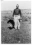 Thumbnail image of item number 1 in: '[Charlie Standifer Holding a Turkey By His Side]'.