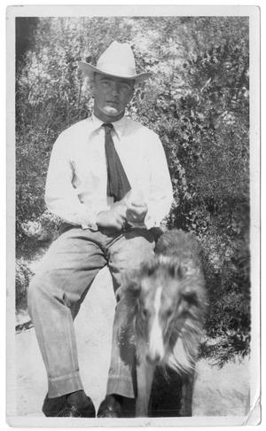 Primary view of object titled '[Watt Matthews Seated Outside with a Dog]'.
