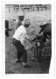 Photograph: [Cowboys Holding and Injecting a Calf]