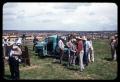 Photograph: [Truck Near Cattle Pens with People Gathered Around]