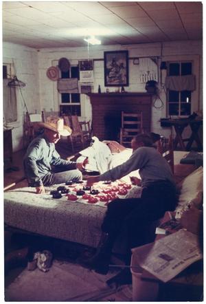 Primary view of object titled '[Richard Ballard and a Cowboy Play Checkers]'.