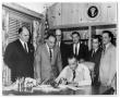 Photograph: President Lyndon Baines Johnson signing document