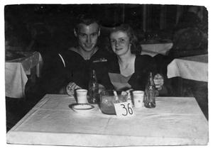 Primary view of object titled '[James E. Sutherlin and Arlene Goodwin Together at a Table]'.