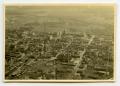 Photograph: [Aerial Photograph of Damaged Town]