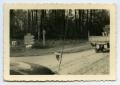 Photograph: [Photograph of Vehicles on Dirt Road]