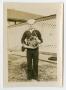 Photograph: [Photograph of a Sailor Holding a French Horn]
