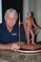 Primary view of [Man Next to Mini Sculpture #2]
