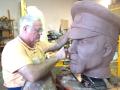 Photograph: [Carving the Head of a Sculpture]