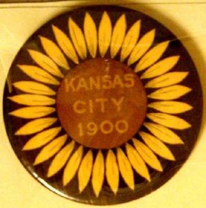 Primary view of object titled '[Button sunflower on black background reads: "KANSAS CITY 1900"]'.