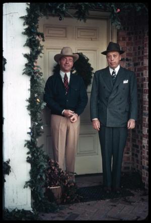 Primary view of object titled '[Watt Matthews and Ardon Judd, Sr. in a Decorated Doorway]'.