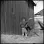 Primary view of [Young Boy Playing with a Toy Revolver]
