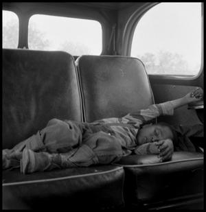 Primary view of object titled '[Child Sleeping in a Car]'.